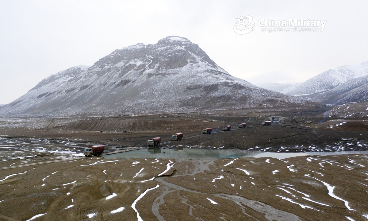 A convoy of military vehicles carrying supplies is en route to a scheduled place during a driving skill training exercise organized by a regiment under the PLA Xinjiang Military Command on June 16, 2021. (eng.chinamil.com.cn/Photo by Li Renxi)