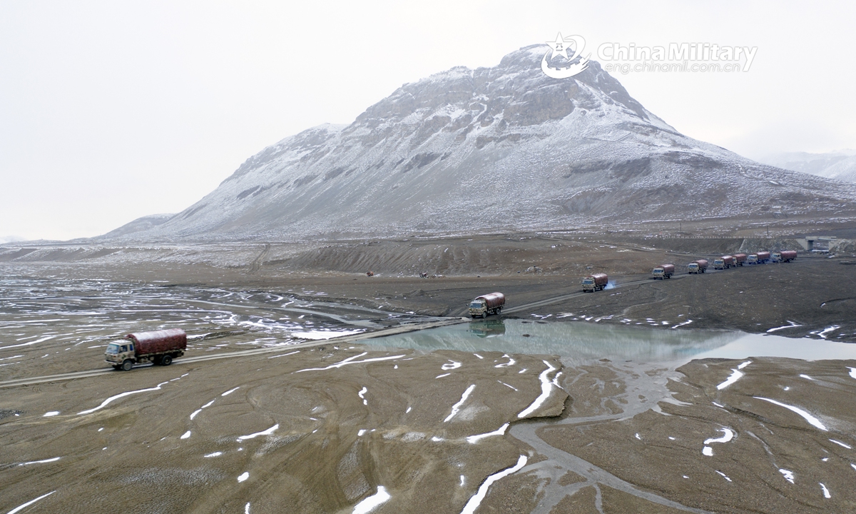 A convoy of military vehicles carrying supplies is en route to a scheduled place during a driving skill training exercise organized by a regiment under the PLA Xinjiang Military Command on June 16, 2021. (eng.chinamil.com.cn/Photo by Li Renxi)