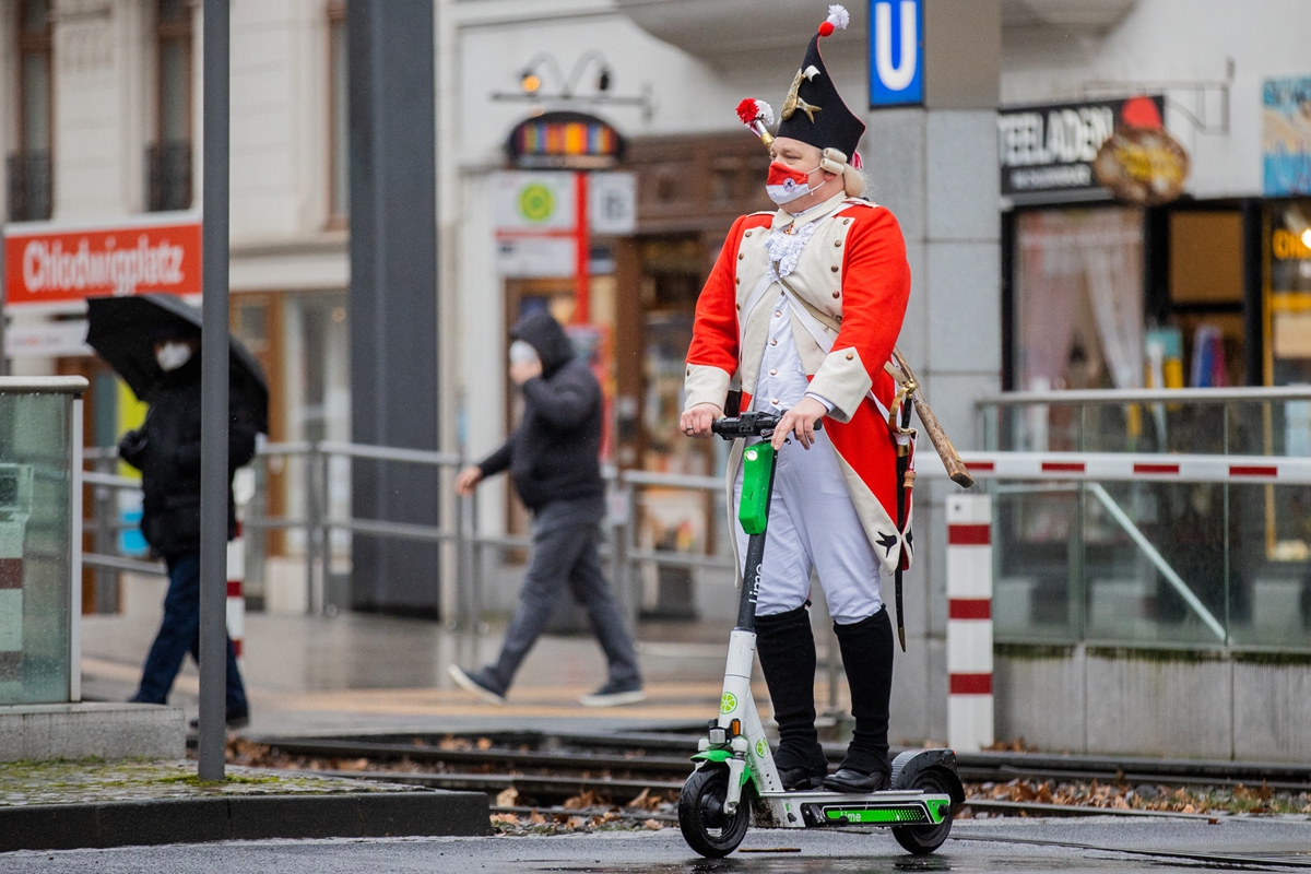 A Jeck rides an e-scooter in Cologne, Germany on February 15. Photo: AFP