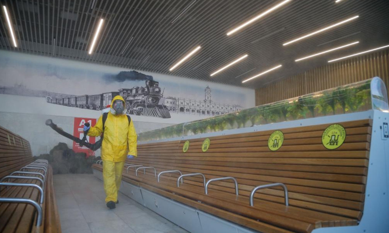 A municipal employee wearing a protective suit disinfects a railway station in Moscow, Russia, on June 24, 2021. Russia logged 20,182 new coronavirus infections over the past 24 hours, the highest daily increase since Jan. 24, taking the nationwide tally to 5,388,695, the official monitoring and response center said Thursday.Photo:Xinhua