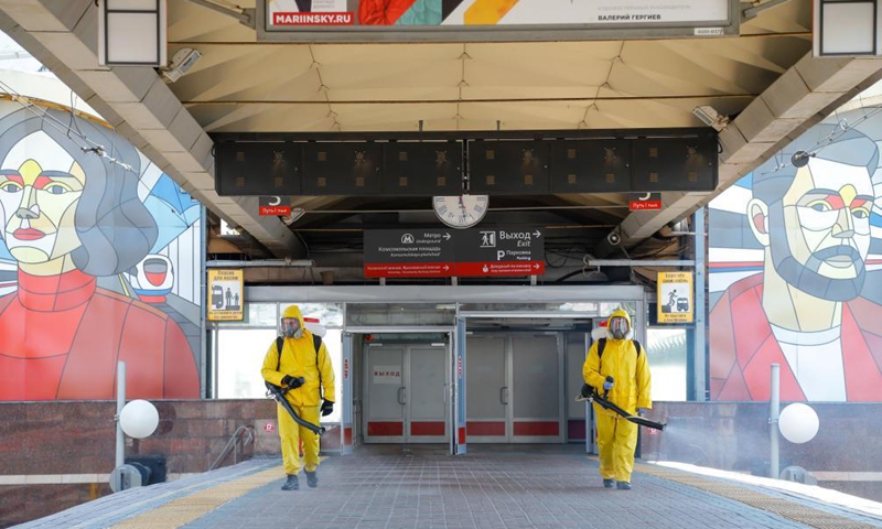 Municipal employees wearing protective suits disinfect a railway station in Moscow, Russia, on June 24, 2021. Russia logged 20,182 new coronavirus infections over the past 24 hours, the highest daily increase since Jan. 24, taking the nationwide tally to 5,388,695, the official monitoring and response center said Thursday.Photo:Xinhua