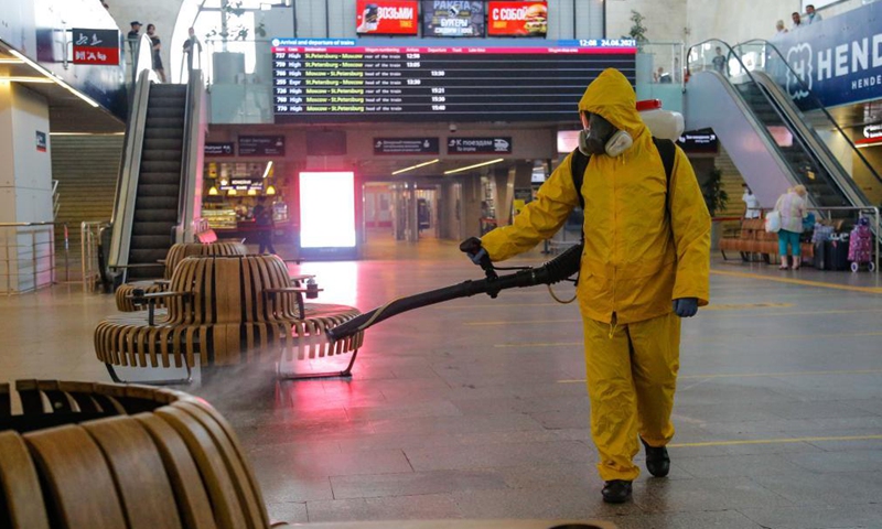 A municipal employee wearing a protective suit disinfects a railway station in Moscow, Russia, on June 24, 2021. Russia logged 20,182 new coronavirus infections over the past 24 hours, the highest daily increase since Jan. 24, taking the nationwide tally to 5,388,695, the official monitoring and response center said Thursday. Photo:Xinhua
