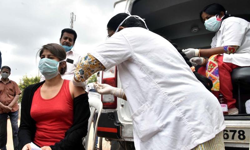 A health worker administers a dose of COVID-19 vaccine to a woman in Hyderabad, India, on June 24, 2021.Photo:Xinhua