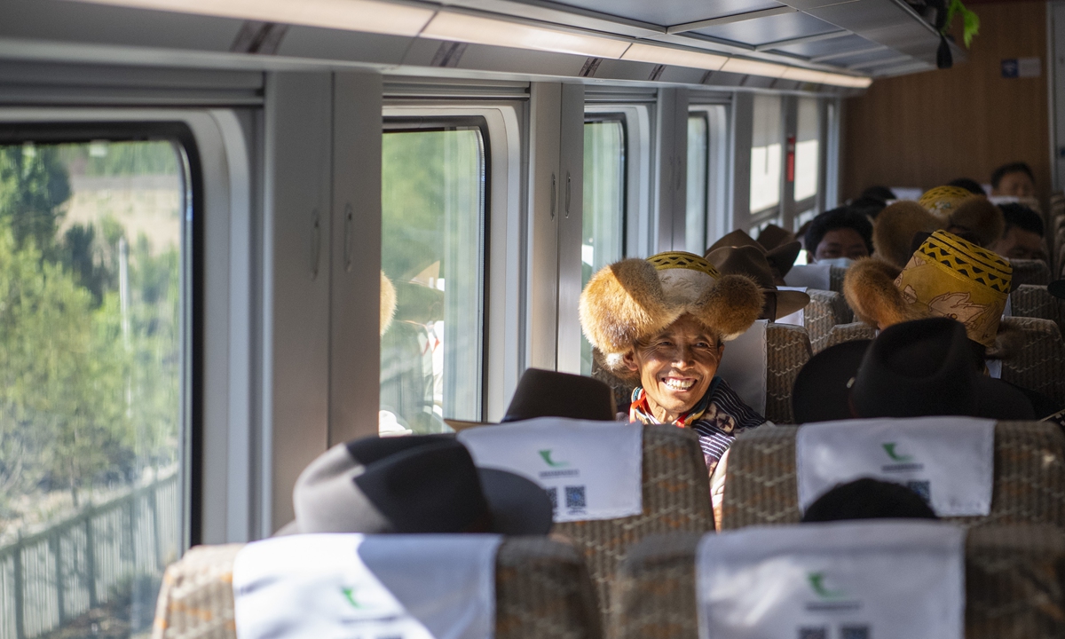  Passengers travel in the bullet train between Lhasa and Nyingchi on Friday. Photo: Xinhua