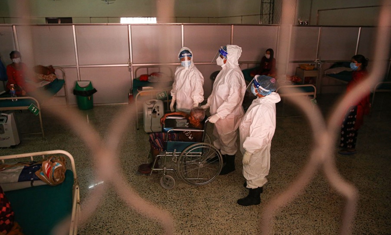 Kalika Devi Baskota has just recovered from COVID-19 in an isolation ward in Kathmandu, Nepal. Photo taken on June 25, 2021.(Photo: Xinhua)