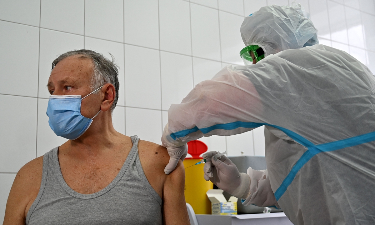 A medical worker receives a dose of COVID-19 vaccine in the hospital of the small Ukrainian town of Brovary on February 24, 2021. Photo: VCG