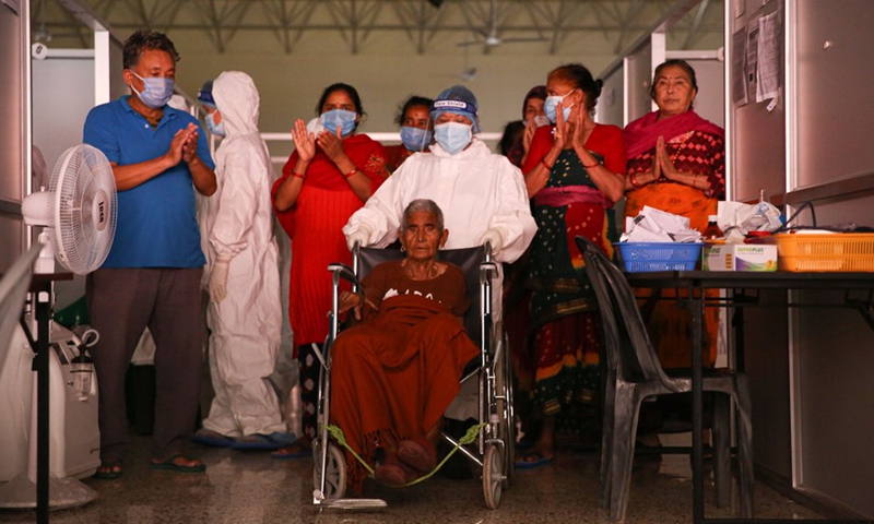 Kalika Devi Baskota, 92, has just recovered from COVID-19 in an isolation ward in Kathmandu, Nepal. Photo taken on June 25, 2021.(Photo: Xinhua)