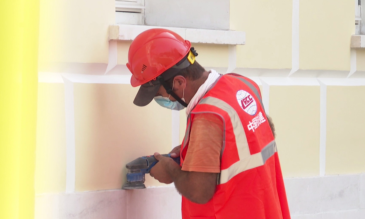 A worker repairs the wall of the exhibition hall on the site of the 6th National Congress of the CPC in Moscow. Photo: Courtesy of China Railway Construction Corp