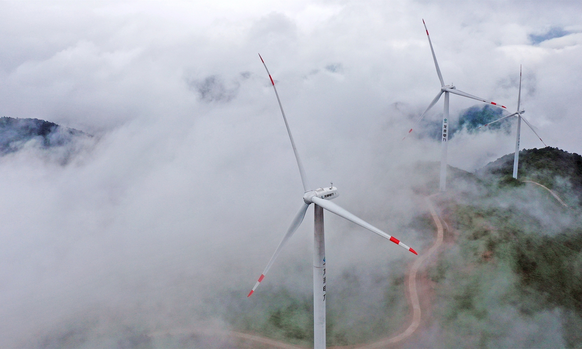 An aerial photo shows wind turbines on the top of a mountain in Taizhou, East China's Zhejiang Province on Tuesday. China has been stepping up a push for renewable energy in recent years. In the first five months of 2021, China produced 238.2 billion kilowatt-hours of wind energy, up 26.7 percent year-on-year. Photo: VCG