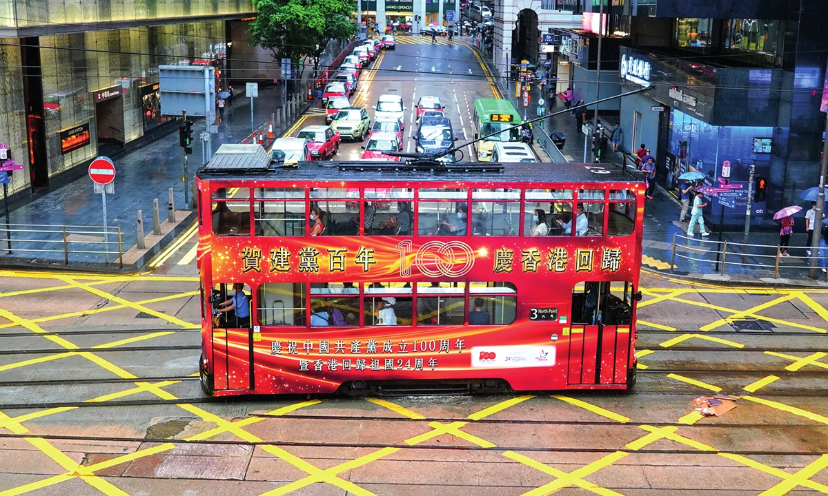A Hong Kong bus is decorated with slogans that celebrate the centennial of the Communist Party of China's founding and the 24th anniversay of Hong Kong's return to the motherland. Photo: IC 