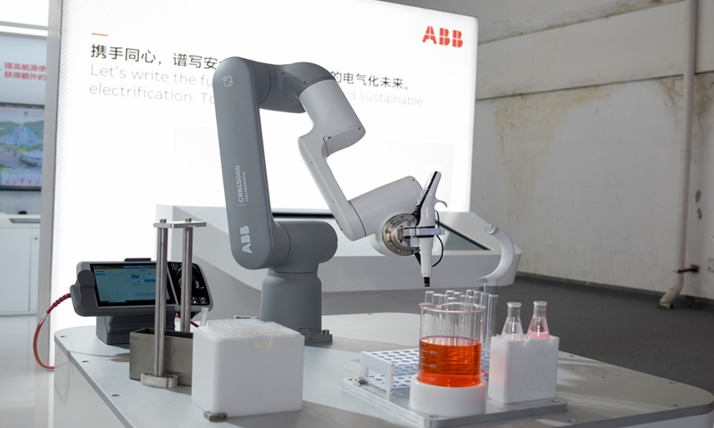 A robotic arm of ABB is showcased at the 2021 World Artificial Intelligence Conference on July 7, 2021. Photo: VCG