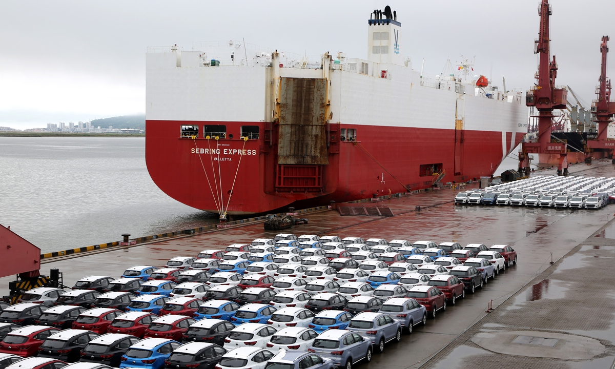 Cars wait to be driven onto a cargo ship headed for the UK on a newly opened shipping lane in Lianyungang Port in East China's Jiangsu Province on Wednesday. China Passenger Car Association data showed that China exported about 760,000 cars in the first five months of the year, up 103 percent year-on-year. Photo: VCG