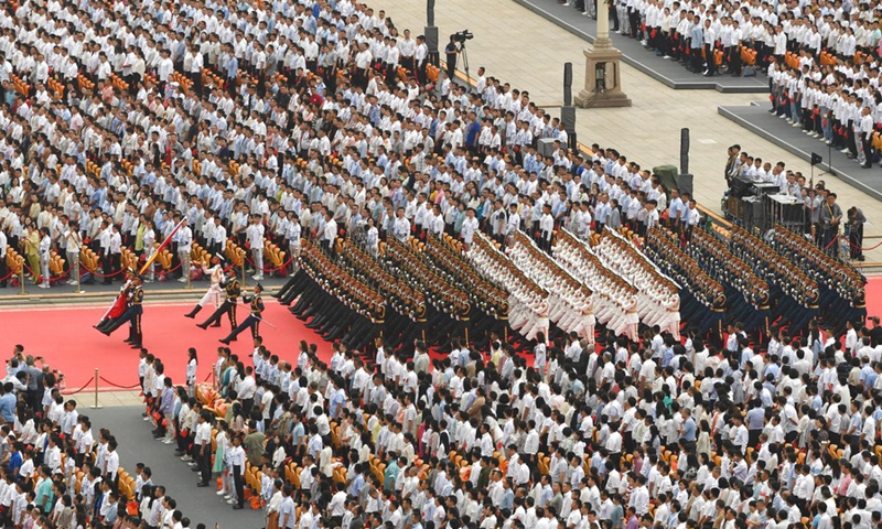 The national flag guards march during a flag-raising ceremony at a grand gathering celebrating the centenary of the Communist Party of China (CPC) at Tian'anmen Square in Beijing, capital of China, July 1, 2021.(Photo: Xinhua)