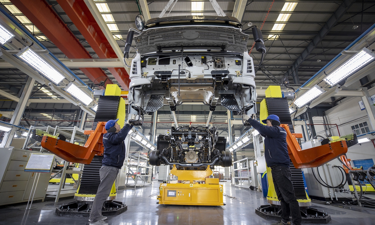 Employees of a commercial EV company in Yancheng, East China's Jiangsu Province, rush to complete orders. Photo: IC 