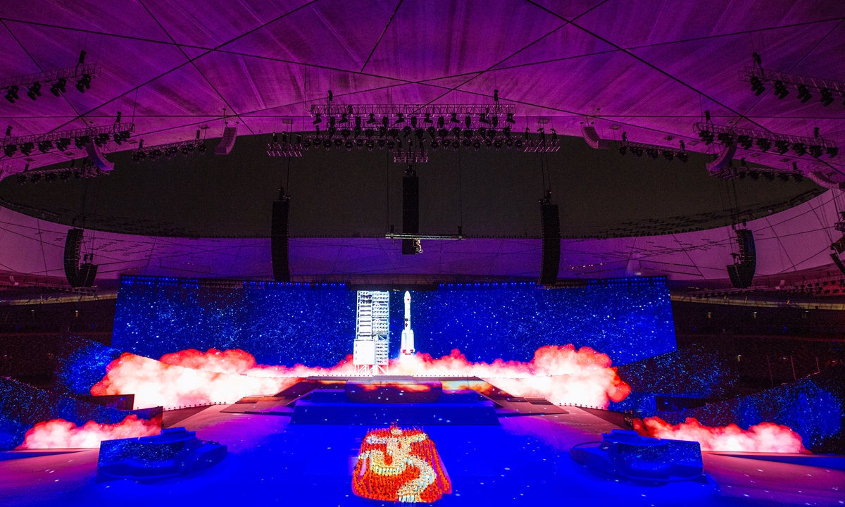 China’s advanced aerospace technology and the emblem for the 2008 Beijing Olympics are featured in a performance to mark the CPC’s centennial. Photo: Li Hao/GT