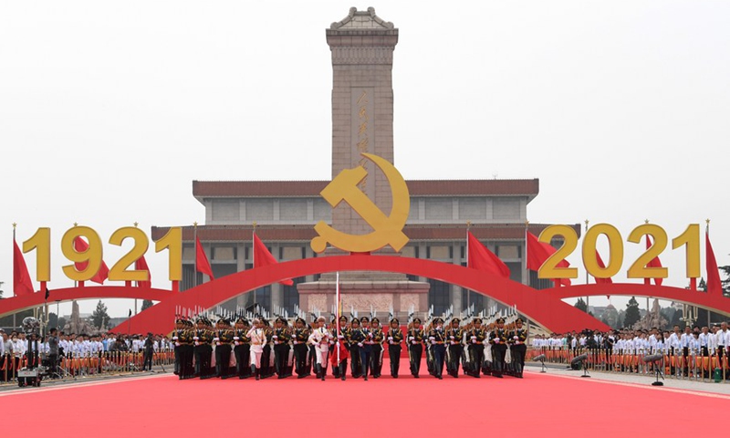 The national flag guards march during a flag-raising ceremony at a grand gathering celebrating the centenary of the Communist Party of China (CPC) at Tian'anmen Square in Beijing, capital of China, July 1, 2021.(Photo: Xinhua)