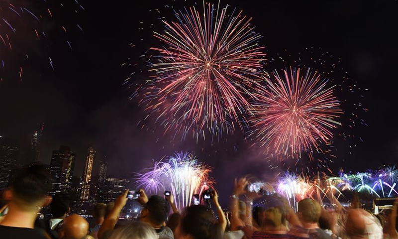 People watch fireworks exploding over the East River during US Independence Day celebration in New York, the United States, July 4, 2019. (Xinhua/Han Fang)