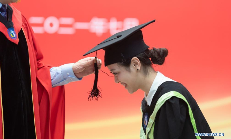 A graduate has her tassel flipped during a graduation ceremony at Beijing Foreign Studies University (BFSU) in Beijing, capital of China, July 2, 2021. BFSU, a university well recognized in China for foreign language education, held a guaduation ceremony for its Class of 2021 graduates on Friday.Photo:Xinhua