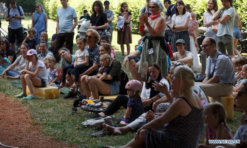 Visitors enjoy shows during the 2021 Ana Desetnica International Street Theatre Festival in Ljubljana, Slovenia, June 30, 2021.Photo:Xinhua