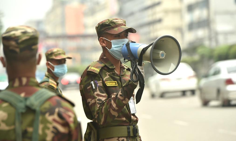 Army personnel are seen on duty on a street during a strict COVID-19 lockdown in Dhaka, Bangladesh, July 1, 2021. Bangladesh is set to enter a one-week strict COVID-19 lockdown from July 1 as the authorities strive to curb the spread of the pandemic.Photo:Xinhua