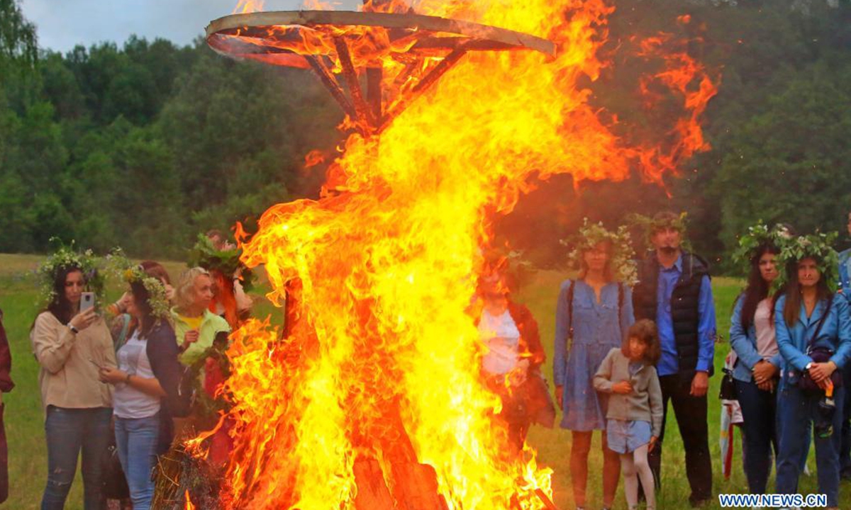 People participate in the celebrations of the Ivan Kupala Festival in the suburb of Minsk, Belarus, July 3, 2021. (Photo by Henadz Zhinkov/Xinhua)
