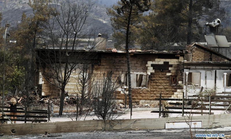 A burned house is seen at Melini village in Limassol district, Cyprus, July 4, 2021. Four people were killed in a mammoth forest fire which has been raging for almost 24 hours in a mountainous area of Cyprus, police said on Sunday.(Photo: Xinhua)