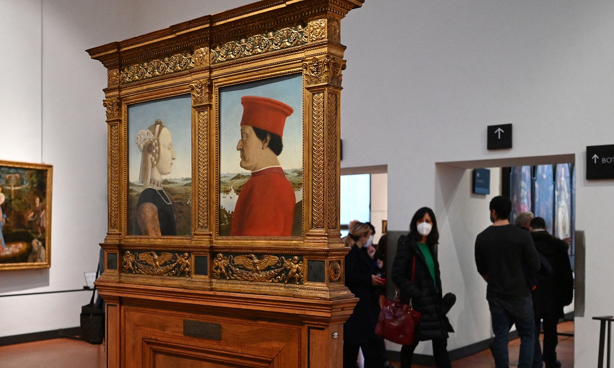 Visitors view Piero della Francesca's 1472-75 Portraits of the Duke and Duchess of Urbino on January 21 during the reopening of the Uffizi Galleries in Florence, Tuscany, Italy. Photo: AFP