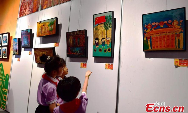 Residents see lacquerwares created by primary school students at an event in Fuzhou, Fujian Province on July 3, 2021. A total of 120 artworks were presented at the event. (Photo/ Zhang Bin)

Fujian Province is one of the birthplaces of Chinese modern lacquer painting. Well-known for its long history and sophisticated crafts, the bodiless lacquerware in Fuzhou was listed as one of China's national intangible heritages in 2006.