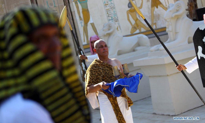People wearing pharaonic costumes perform during a pharaonic wedding ceremony held to revitalize tourism affected by the COVID-19 pandemic at Pharaonic Village in Giza, Egypt, on July 5, 2021.(Photo: Xinhua)