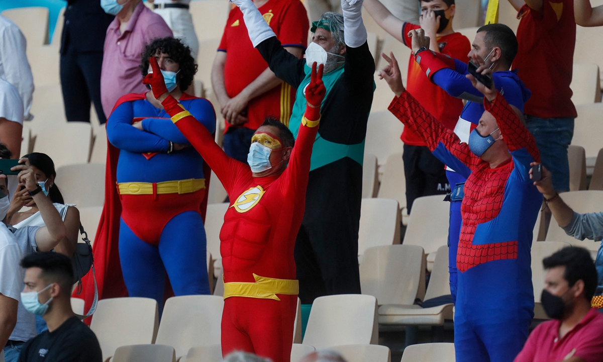 Fans dressed as superheroes including supermen cheer on their teams at La Cartuja Stadium in Seville, Spain, on June 14. Photo: AFP