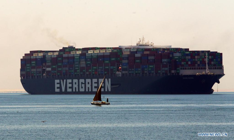 Photo taken on July 7, 2021 shows the Ever Given container ship sailing on the Great Bitter Lake in Ismailia Province, Egypt. The Ever Given container ship which blocked the Suez Canal for nearly a week in March began its journey out of the canal on Wednesday, said Suez Canal Authority (SCA) Chairman Osama Rabie.(Photo: Xinhua)