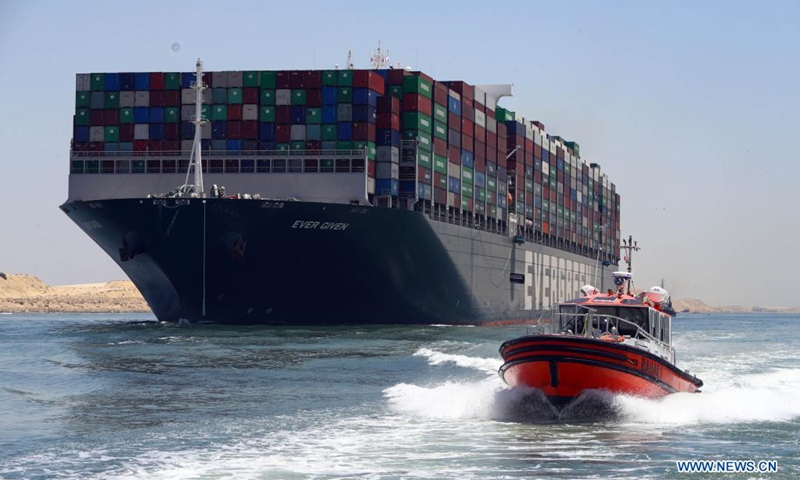 Photo taken on July 7, 2021 shows the Ever Given container ship sailing on the Suez Canal in Ismailia Province, Egypt. The Ever Given container ship which blocked the Suez Canal for nearly a week in March began its journey out of the canal on Wednesday, said Suez Canal Authority (SCA) Chairman Osama Rabie.(Photo: Xinhua)