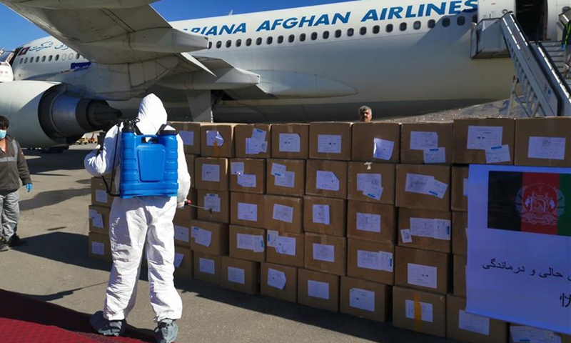 Afghan health workers disinfect medical supplies donated by China ahead of a handover ceremony in Kabul, Afghansitan, April 2, 2020.File photo:Xinhua