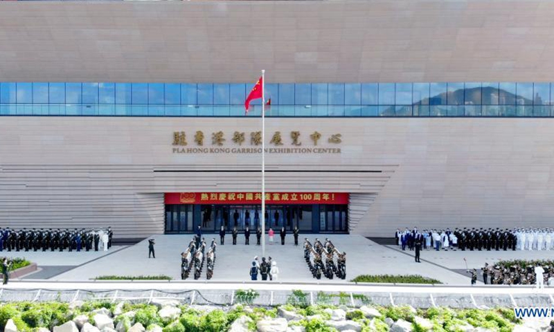 A national flag-raising ceremony is held before the opening ceremony of the exhibition center of the Chinese People's Liberation Army (PLA) Garrison in the Hong Kong Special Administrative Region (HKSAR) at the Ngong Shuen Chau Barracks in Hong Kong, south China, July 8, 2021.Photo:Xinhua