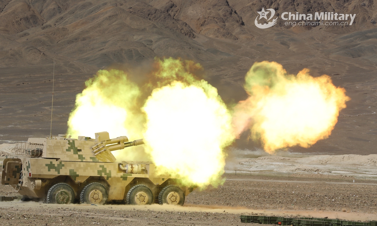 Vehicle-mounted howitzers attached to an artillery detachment with a combined arms regiment under the PLA Army fires high explosive shells at mock remote targets during a live-fire training exercise in depopulated region in mid-June, 2021. The exercise focused on such training items as autonomous surveillance, reduced-crew operation, motorized mobilization.Photo:China Military