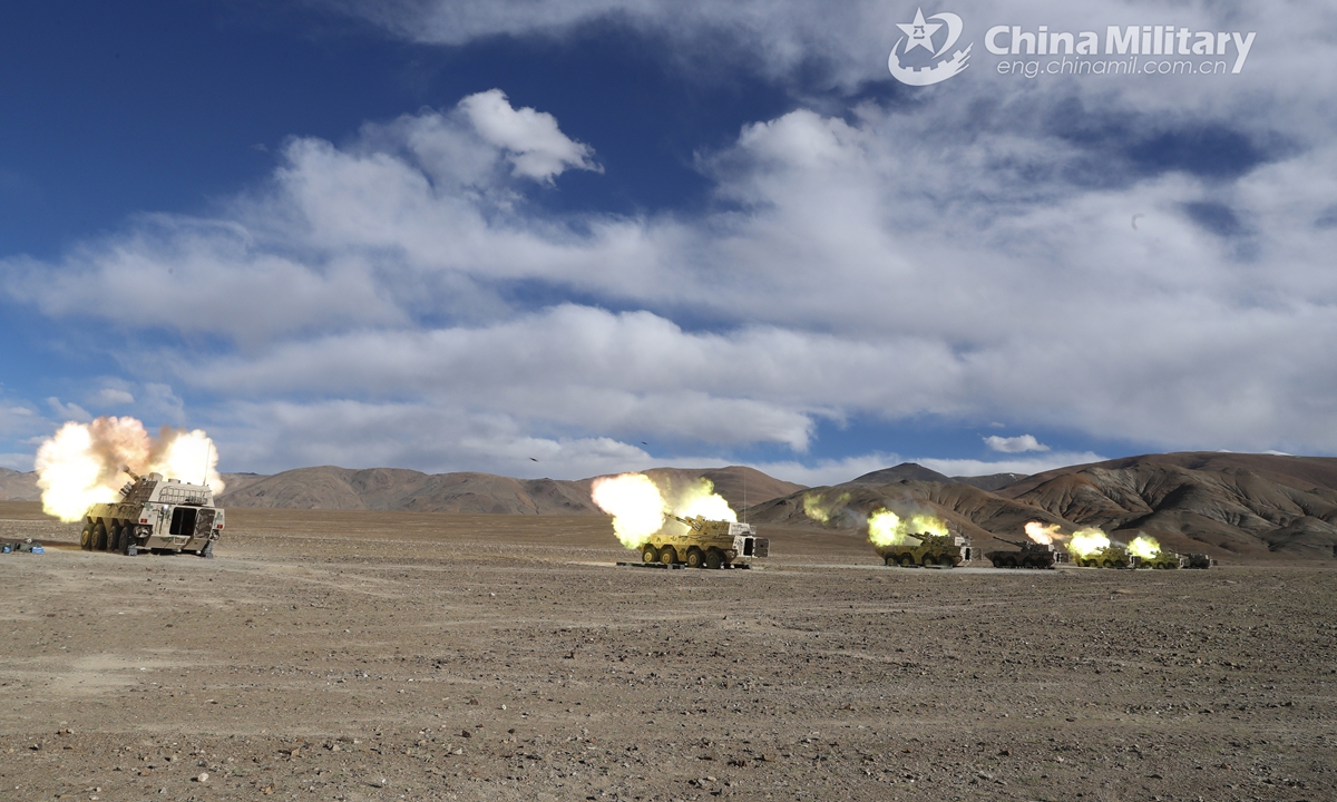 Vehicle-mounted howitzers attached to an artillery detachment with a combined arms regiment under the PLA Army fires high explosive shells at mock remote targets during a live-fire training exercise in depopulated region in mid-June, 2021. The exercise focused on such training items as autonomous surveillance, reduced-crew operation, motorized mobilization.Photo:China Military