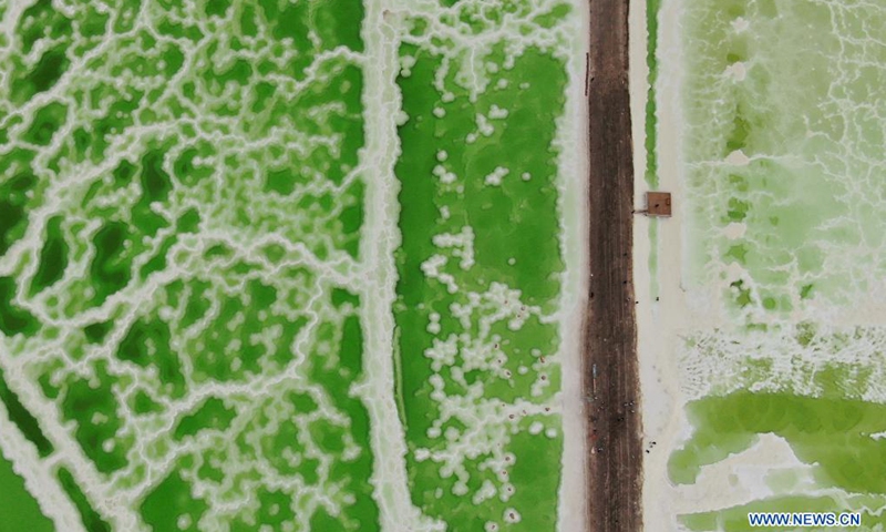 Aerial photo taken on July 8, 2021 shows the Qairhan Salt Lake in northwest China's Qinghai Province. The Qairhan Salt Lake in the Qaidam Basin has been the largest potash fertilizer producing base in China. It came to exhibit its values as a tourism destination under a series of comprehensive local development schemes.Photo:Xinhua
