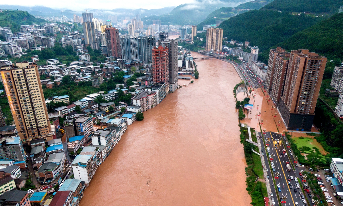Torrential rain causes the flooding of the Tongjiang River over the sightseeing trails along the bank and inundated the lower storeys of the buildings in Bazhong, Southwest China's Sichuan Province. Photo: VCG