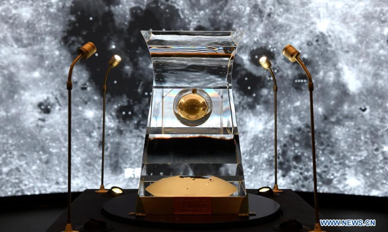 The lunar samples No. 001 brought back by China's Chang'e-5 probe is displayed at the National Museum of China in Beijing, capital of China, Feb. 27, 2021. An exhibition displaying the lunar samples No. 001 brought back by China's Chang'e-5 probe is held here on Saturday.(Photo: Xinhua)