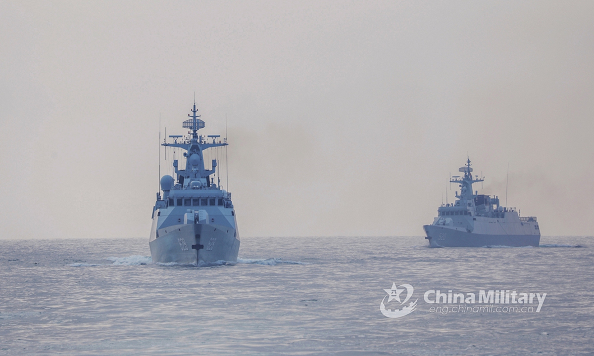 Two warships attached to a naval frigate flotilla under PLA's Southern Theater Command carry out coordination drill during a maritime combat training exercise on April 21, 2021. Photo: China Military Online