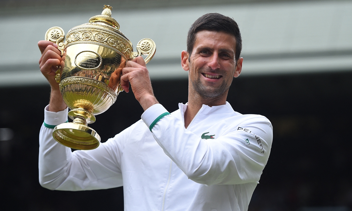 Novak Djokovic celebrates winning the 2021 Wimbledon on Sunday in London, England. Photo: AFP