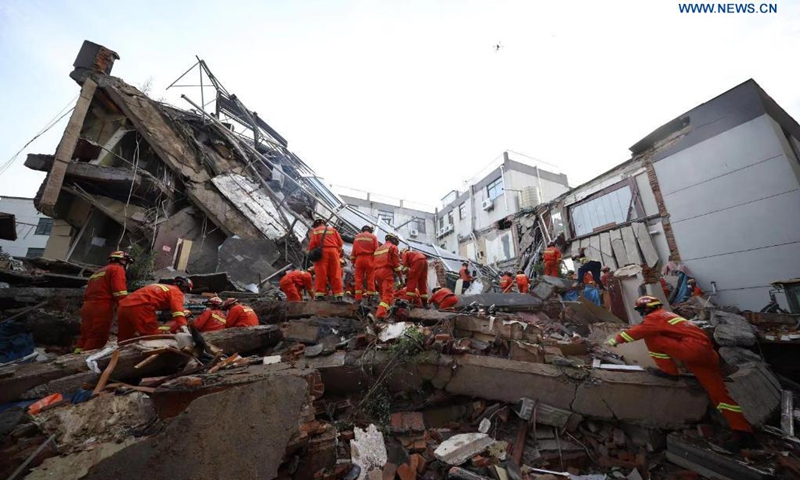 Rescuers work at the site of a collapsed building in Suzhou, east China's Jiangsu Province, July 12, 2021. One person died, and another 10 people are missing after a building collapsed Monday in east China's Jiangsu Province, local authorities said. The incident happened at around 3:33 p.m. Monday at a hotel in Wujiang District in the city of Suzhou, the district government said. (Photo: Xinhua)