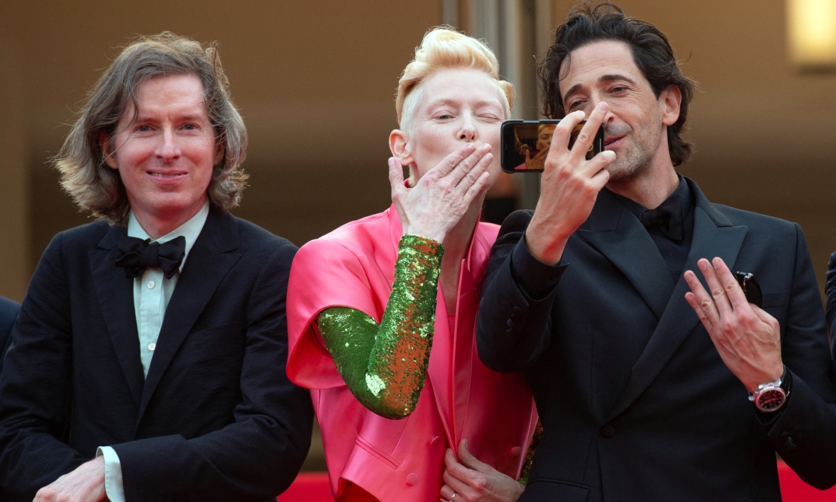 From left: Wes Anderson, Tilda Swinton and Adrien Brody attend The French Dispatch premiere as part of the 74th Cannes International Film Festival in Cannes, France on Sunday. Photo: IC