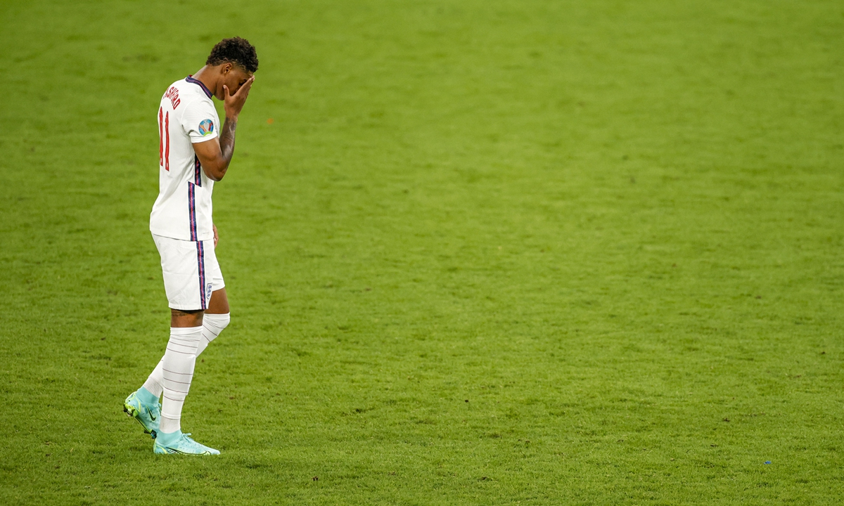 England's Marcus Rashford reacts after missing his shot during a penalty shootout at the Euro 2020 final on Sunday. Photo: VCG