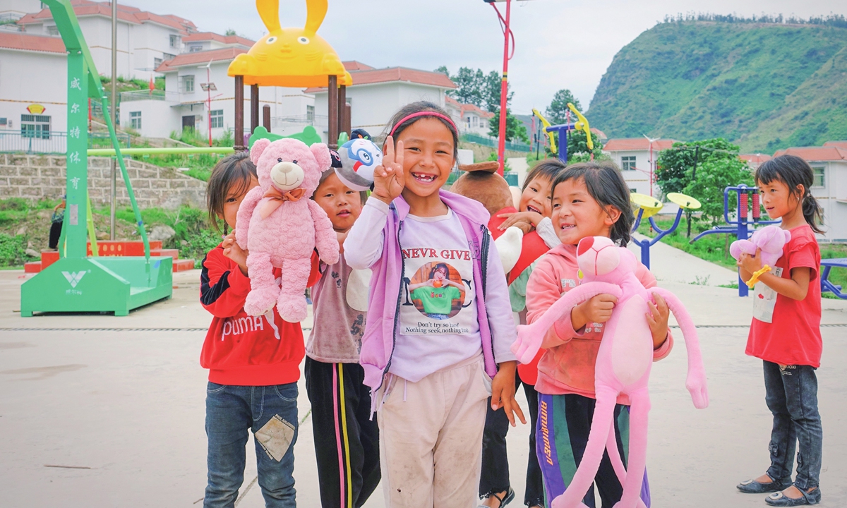 Female students take their school-issued toys to the playground  at recess in Huobo village in Puge county, Liangshan, on June 30. Photo: Lin Xiaoyi/GT
