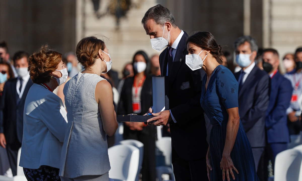 Spain's King Felipe (center) and Queen Letizia present the Great Cross&nbsp;of&nbsp;the&nbsp;Order&nbsp;of Civil Merit to medical workers during a ceremony to honor the victims of COVID-19 and health workers at the Royal Palace in Madrid, Spain on Thursday. Spain has recorded over 81,000 deaths from COVID-19.