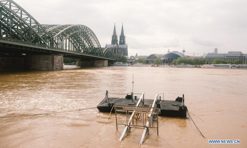 The bank of the river Rhine is seen flooded in Cologne, western Germany, on July 15, 2021. Flooding in the western German states of Rhineland-Palatinate and North Rhine-Westphalia due to persistent rainfall has left at least 58 people dead and dozens missing, local media reported.Photo:Xinhua