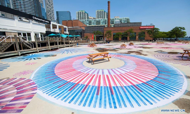 A floor mural with spirals, loops and circles is seen during a visual arts exhibition at Hahourfront Center in Toronto, Canada, on July 14, 2021.Photo:Xinhua