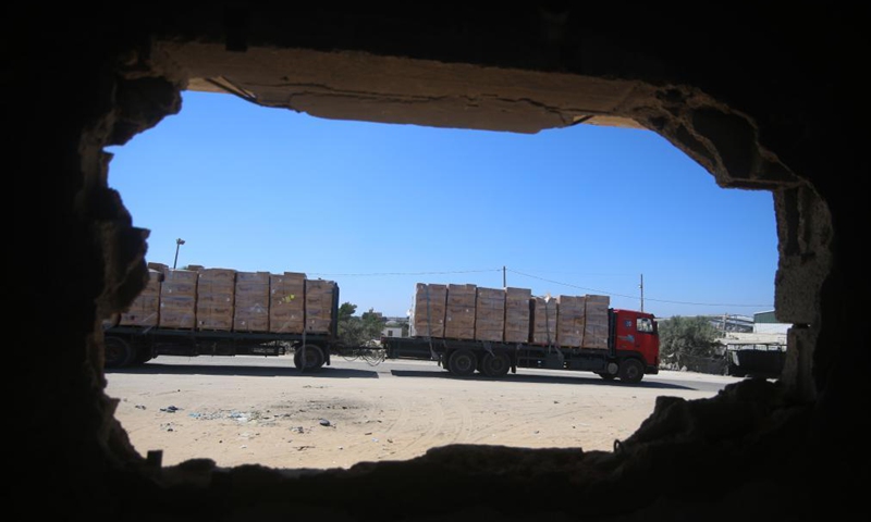 A loaded trailer truck arrives at the Kerem Shalom commercial crossing in the southern Gaza Strip city of Rafah, July 14, 2021.Photo:Xinhua