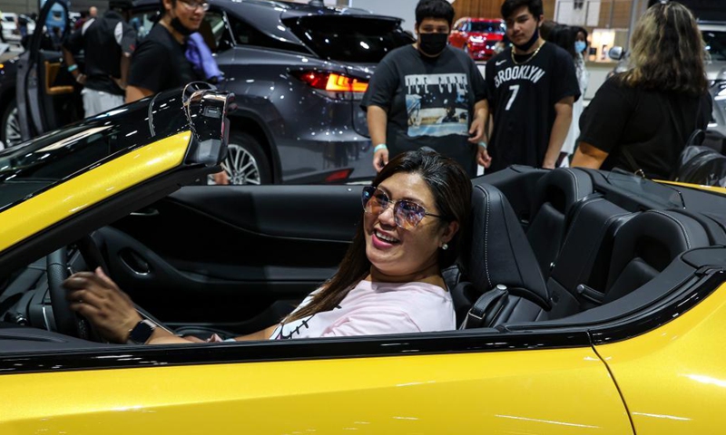 A visitor is seen in a 2021 Lexus LS 500 convertible at the 2021 Chicago Auto Show held at McCormick Place in Chicago, the United States, on July 15, 2021. The 2021 Chicago Auto Show kicked off on Thursday with more than 20 manufacturers from all over the world showcasing their latest vehicles.Photo:Xinhua